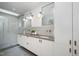 Double vanity bathroom with modern fixtures and a large shower at 515 W Lenoir St # 101, Raleigh, NC 27601