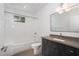 Clean bathroom with a modern vanity, bathtub, and shower at 515 W Lenoir St # 101, Raleigh, NC 27601
