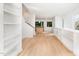 Open concept living room with hardwood floors and kitchen view at 515 W Lenoir St # 102, Raleigh, NC 27601