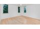 Spacious bedroom with hardwood floors and multiple windows at 515 W Lenoir St # 102, Raleigh, NC 27601