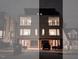 Modern two-unit building with sleek design and double garages at night at 515 W Lenoir St # 102, Raleigh, NC 27601