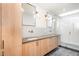 Modern bathroom with double vanity and glass shower at 515 W Lenoir St # 102, Raleigh, NC 27601