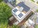 Modern home with rooftop deck and solar panels, aerial view at 515 W Lenoir St # 102, Raleigh, NC 27601