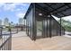 Rooftop deck with solar panels and city views at 515 W Lenoir St # 102, Raleigh, NC 27601