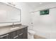 Modern bathroom with gray vanity and white tile at 515 W Lenoir St # 102, Raleigh, NC 27601