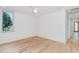 Hardwood floor bedroom with ceiling fan and window at 515 W Lenoir St # 102, Raleigh, NC 27601