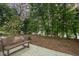 Relaxing common area with a park bench and landscaping at 515 W Lenoir St # 102, Raleigh, NC 27601