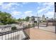 Spacious rooftop deck with city views and modern metal railing at 515 W Lenoir St # 102, Raleigh, NC 27601