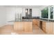 Modern kitchen with stainless steel appliances and an island at 515 W Lenoir St # 102, Raleigh, NC 27601