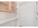 Bright laundry room with wood cabinets and shelf at 515 W Lenoir St # 102, Raleigh, NC 27601
