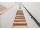 Modern light-wood staircase with black railing at 515 W Lenoir St # 102, Raleigh, NC 27601