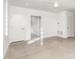 Bright bedroom with concrete floors and doors to hallway at 515 W Lenoir St # 102, Raleigh, NC 27601