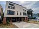 Modern two-story home with attached garage and brick exterior at 515 W Lenoir St # 102, Raleigh, NC 27601
