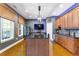 Game room with wet bar, dark wood cabinets, and stained concrete floors at 69 Romie Ct, Pittsboro, NC 27312