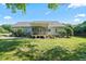 House exterior showcasing a screened porch and backyard at 15 Meadow View Ct, Fuquay Varina, NC 27526