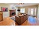 Spacious living room features hardwood floors, fireplace, and plenty of natural light at 15 Meadow View Ct, Fuquay Varina, NC 27526