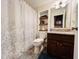 Bathroom with shower/tub, granite vanity, and built-in shelves at 15 Meadow View Ct, Fuquay Varina, NC 27526