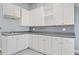 Garage workshop area with white cabinets and a sink at 15 Meadow View Ct, Fuquay Varina, NC 27526