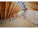 Unfinished bonus room with wood framing and flooring at 15 Meadow View Ct, Fuquay Varina, NC 27526