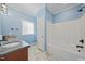 Bathroom with double vanity, soaking tub, and tile floors at 15 Meadow View Ct, Fuquay Varina, NC 27526