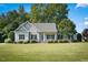 Ranch style home with a well-manicured lawn at 15 Meadow View Ct, Fuquay Varina, NC 27526