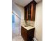 Basement wet bar with granite countertop and wood cabinets at 15 Meadow View Ct, Fuquay Varina, NC 27526