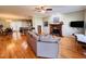Living room with hardwood floors, fireplace, and open floor plan at 15 Meadow View Ct, Fuquay Varina, NC 27526