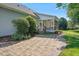 Brick paved patio adjacent to screened porch and lush lawn at 15 Meadow View Ct, Fuquay Varina, NC 27526