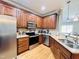 Modern kitchen with stainless steel appliances and granite countertops at 15 Meadow View Ct, Fuquay Varina, NC 27526