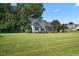 House exterior showcasing ample yard space at 15 Meadow View Ct, Fuquay Varina, NC 27526
