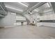 Spacious garage with overhead storage and built-in cabinets at 15 Meadow View Ct, Fuquay Varina, NC 27526