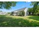 View of the house from the backyard, highlighting the screened porch at 15 Meadow View Ct, Fuquay Varina, NC 27526