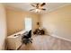 Home office with desk, chair, and plenty of natural light at 15 Meadow View Ct, Fuquay Varina, NC 27526