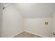 A bright laundry room with tile flooring and overhead storage at 15 Meadow View Ct, Fuquay Varina, NC 27526