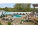 Kidney shaped pool with a deck and lounge chairs at 4600 Scottland Dr, Mebane, NC 27302