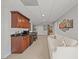 Finished basement with wet bar, lounge area, and access to other rooms at 4600 Scottland Dr, Mebane, NC 27302