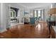 Open living area with hardwood floors, neutral decor, and French doors at 4600 Scottland Dr, Mebane, NC 27302