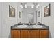 Double vanity bathroom with granite countertop and wood cabinets at 4600 Scottland Dr, Mebane, NC 27302