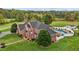 Aerial view of a luxurious house with a pool and expansive green lawn at 4600 Scottland Dr, Mebane, NC 27302