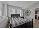 Basement bedroom with a comfortable bed and large windows at 4600 Scottland Dr, Mebane, NC 27302