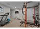 Home gym in the basement featuring a treadmill and weight machine at 4600 Scottland Dr, Mebane, NC 27302