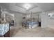 Elegant main bedroom features a comfortable bed and en-suite bathroom access at 4600 Scottland Dr, Mebane, NC 27302