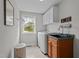 Bright laundry room with washer, dryer, and a utility sink at 4600 Scottland Dr, Mebane, NC 27302