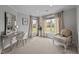 Bright sitting area with a comfortable chair and large windows offering a view at 4600 Scottland Dr, Mebane, NC 27302