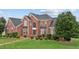 Brick home with a large front yard and walkway at 4600 Scottland Dr, Mebane, NC 27302