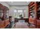 Spacious home office, built-in shelving, hardwood floors, and window seat at 4600 Scottland Dr, Mebane, NC 27302