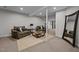 Basement lounge area with comfortable seating and large mirror at 4600 Scottland Dr, Mebane, NC 27302