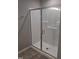 Modern shower with glass enclosure and tiled flooring at 727 Putney Hill Rd, Zebulon, NC 27597