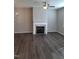 Living room with fireplace and neutral tone flooring at 727 Putney Hill Rd, Zebulon, NC 27597