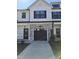 Two story home with stone and white accents at 727 Putney Hill Rd, Zebulon, NC 27597